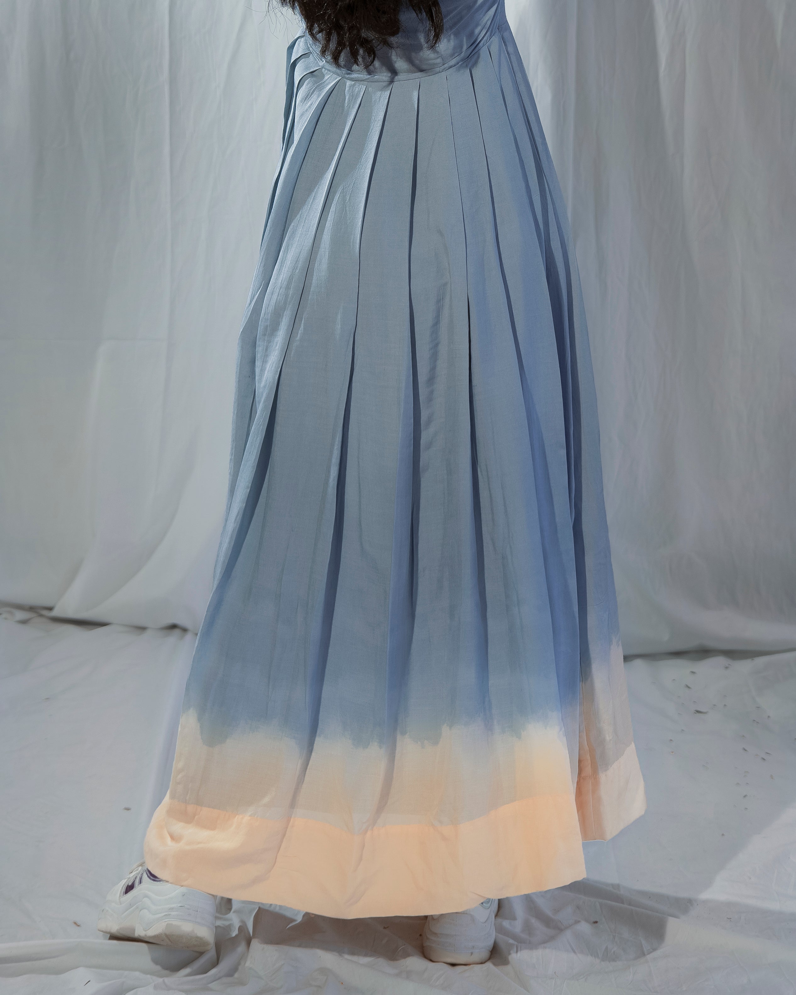 Long, gradient dress with blue to beige color 
